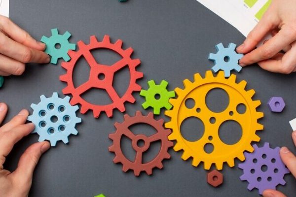 still-life-business-roles-with-various-mechanism-pieces_23-2149352652